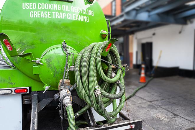 a pump truck emptying a grease trap in Akron, NY